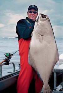 Doug Tallman, Olympia, redefines the definition of a good day after boating this 84 - pound halibut. The Washington halibut season is just around the corner and Admiral Fish suggests it’s not too early to get your halibut fishing gear ready to go.