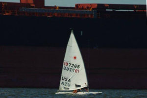 Derick Vranizan working upwind against the backdrop of a freighter.
