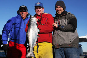 Fisherman Bruce, center, with his latest Chinook.